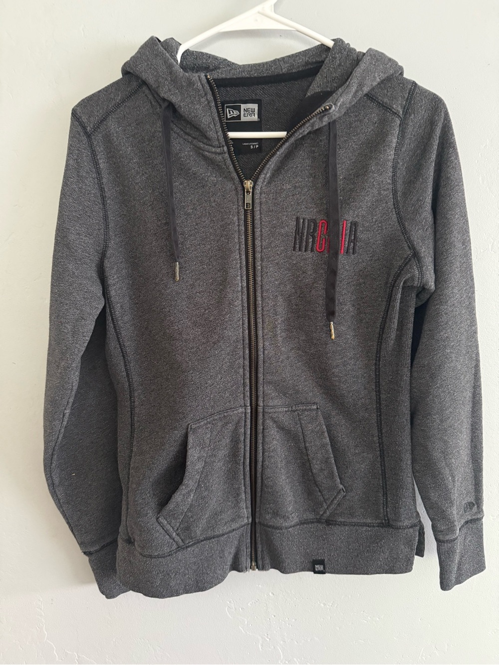 New Era woman's Dark Gray Zip Hoodie with Red Logo Accent